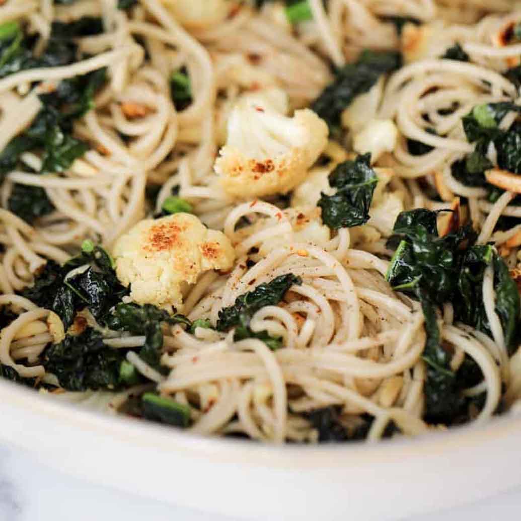 cauliflower mixed with noodles and green spinach
