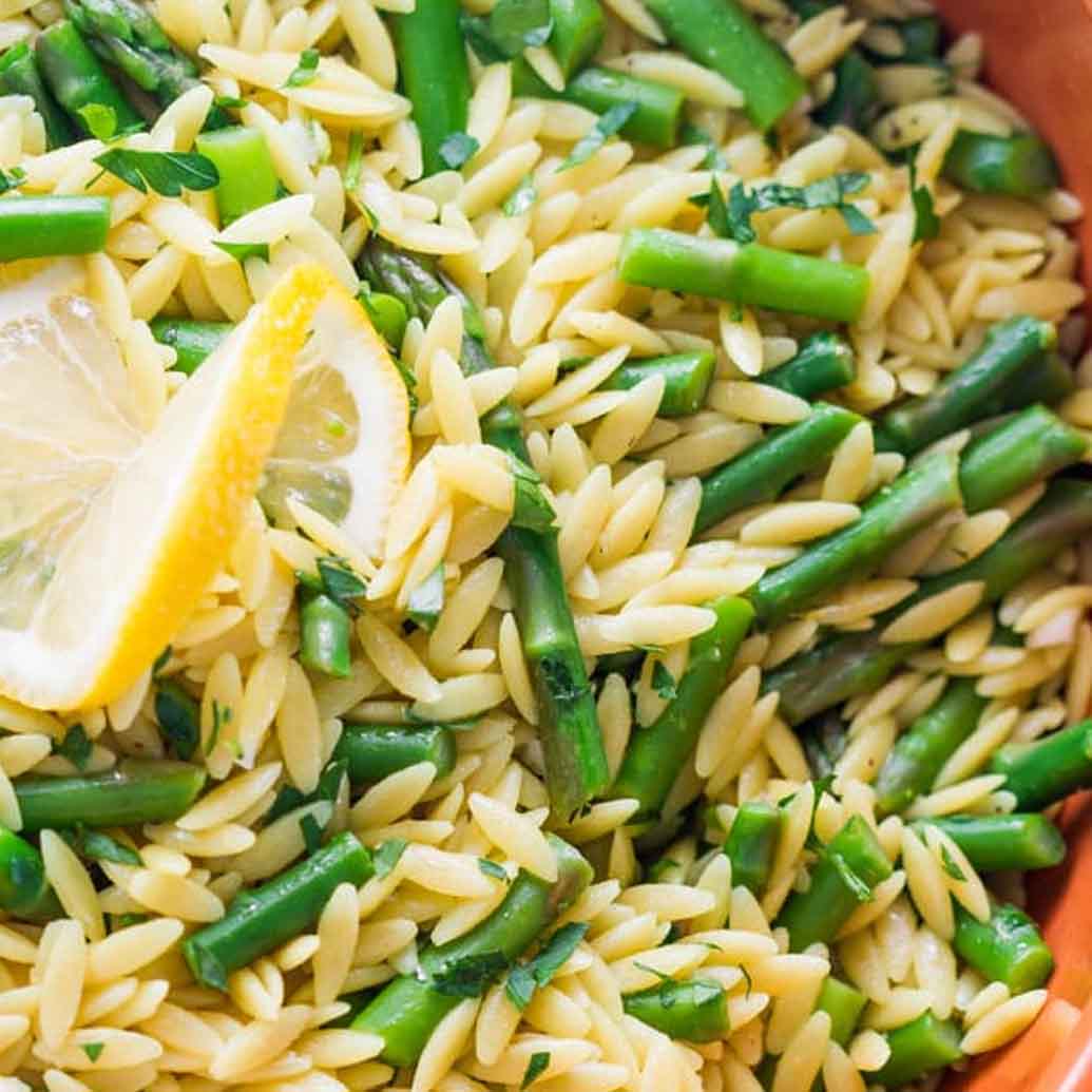 orzo rice with aspargus and lemon topped with cilantro